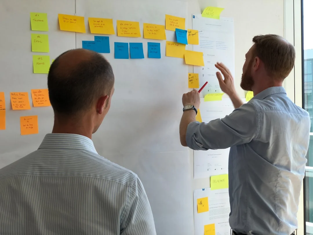 Sticky notes with holiday marketing ideas for Christmas social media and email campaigns.